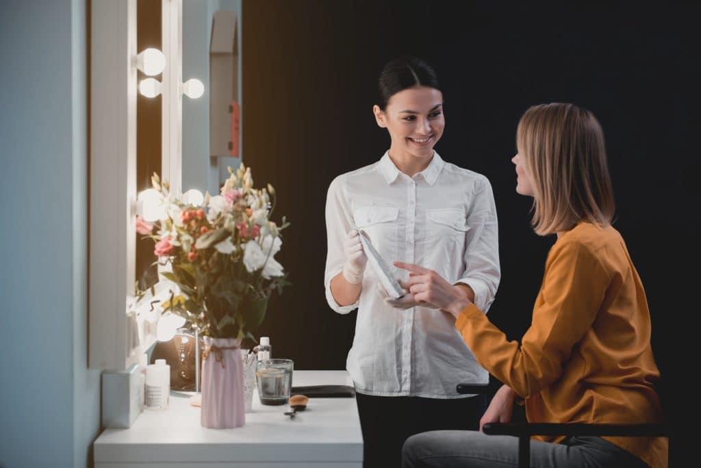 Financial aid adviser helping a beauty school student in West Palm Beach